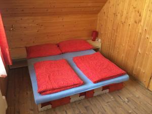 A bed or beds in a room at chatyliptov v srdci LIPTOVA