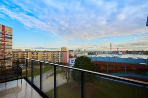 a balcony with a view of a city at Apartamenty Świnoujście - Matejki 1b in Świnoujście