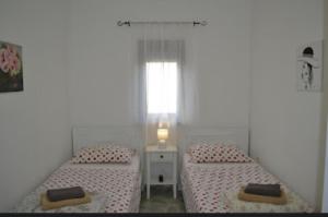 Un pat sau paturi într-o cameră la Apartment Lora