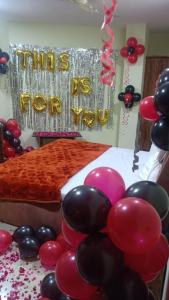a party with balloons and a sign that reads this is for you at Shagun Banquet and Hotel in Gwalior