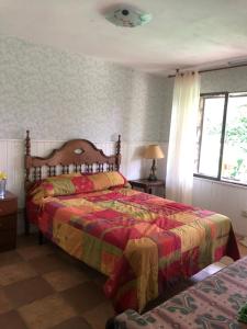 Postel nebo postele na pokoji v ubytování Casa Rural Pantano de San Juan