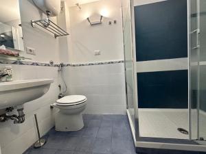 a bathroom with a toilet and a sink and a shower at Pantheon Palazzo Nari #9 in Rome