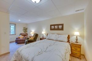 a bedroom with a large bed and two chairs at The Haven at Welsh Mountain Suites - Apt with Patio! in New Holland