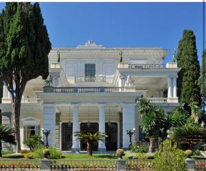 a large white house with trees in front of it at The Gastouri House, Located In Central Corfu, Near Benitses in Gastouri