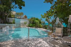 Бассейн в Impression Isla Mujeres by Secrets - Adults Only - All Inclusive или поблизости