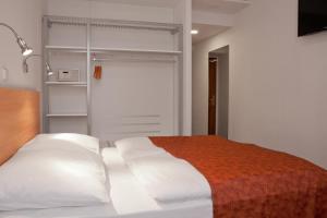 Cama o camas de una habitación en Hotel Ambiance
