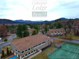 an aerial view of a house with a tennis court at Cathedral Ledge Resort in North Conway