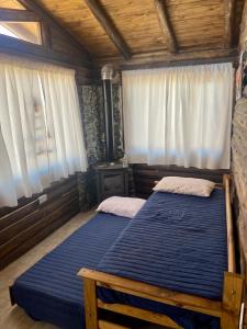 Postel nebo postele na pokoji v ubytování Naol village