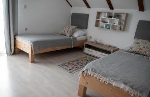 Postel nebo postele na pokoji v ubytování Apartman Milutin