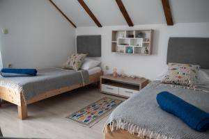 Postel nebo postele na pokoji v ubytování Apartman Milutin
