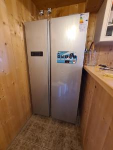 A kitchen or kitchenette at Burtscha Lodge