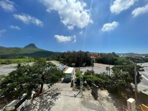 a view of a street with a mountain in the background at Dajenshan Hotel in Kenting