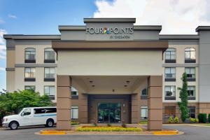a front view of a four points hotel at Four Points by Sheraton Nashville Airport in Nashville