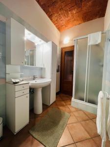 a bathroom with a sink and a shower at V HOME in Biella +29 photos