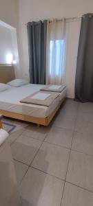 Кровать или кровати в номере Sweetmar Rooms-Ground floor