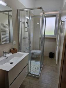 a bathroom with a shower and a sink at Casa vacanze Moretto in Ceglie Messapica
