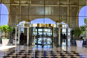 a lobby with a revolving door in a building at Azura Deluxe Resort & Spa - Ultra All Inclusive in Avsallar
