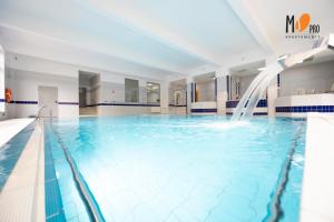 Piscina de la sau aproape de MS Pro Apartamenty OLYMP strefa SPA