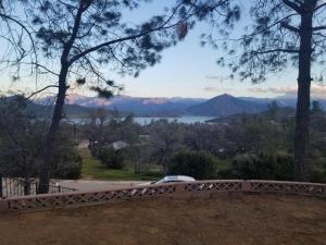 a car on a bridge with a view of the mountains at Lake Isabella View, Wofford Heights, Kern County in Wofford Heights +7 photos