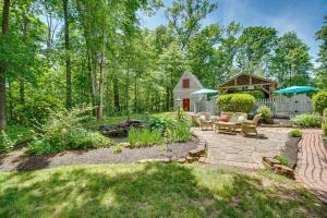 a backyard with a fire pit and a barn at Cozy Virginia Vacation Rental with Seasonal Pool! in Nokesville