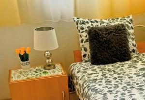 A bed or beds in a room at Atlantis apartman
