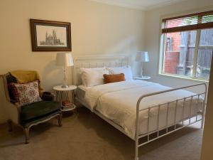 A bed or beds in a room at Luxury Inner City Townhouse