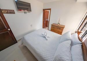 Giường trong phòng chung tại Sleep Well