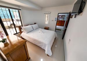 Giường trong phòng chung tại Sleep Well