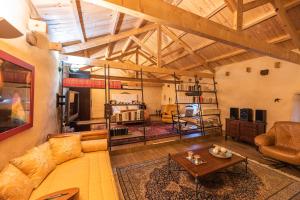 a large living room with a couch and a table at Descubre La Cepedana: Casa rural con encanto en Cogorderos, a solo 10 km de Astorga in Cogorderos