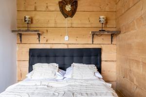 Posteľ alebo postele v izbe v ubytovaní Hacienda Domek Bliźniaczy z Widokiem na Tatry