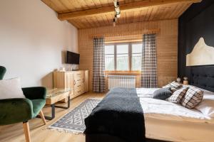 Posteľ alebo postele v izbe v ubytovaní Hacienda Domek Bliźniaczy z Widokiem na Tatry