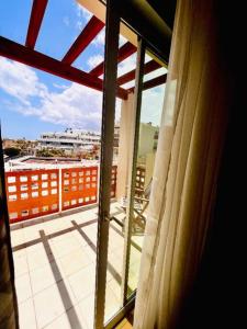 a view of a balcony from a window of a building at 3-bedrooms apartament Vista Roja in Granadilla de Abona