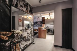 a living room with a large mirror on the wall at EXCLUSIVE APARTMENTS ZATOR in Zator