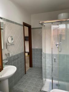 a bathroom with a shower and a sink at CASA VACANZA DAMAR in Mascali