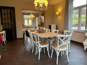a dining room with a table and chairs at Les 3 Soeurs in Han-sur-Lesse