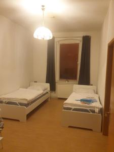 Postel nebo postele na pokoji v ubytování Monteurwohnung bei Nina
