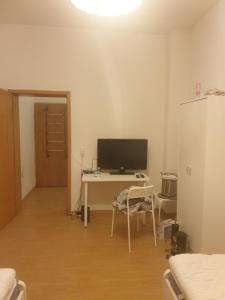 TV a/nebo společenská místnost v ubytování Monteurwohnung bei Nina