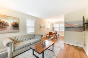 a living room with a couch and a table at Modern Alexandria Townhome about 2 Mi to Old Town! in Alexandria