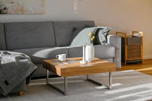 a living room with a couch and a coffee table at Helle Deel in Fehmarn