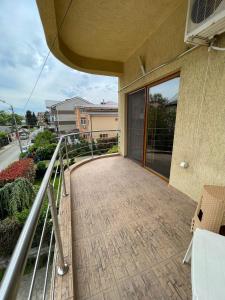 a balcony of a house with a walkway at Vila Senator 1 in Eforie Nord