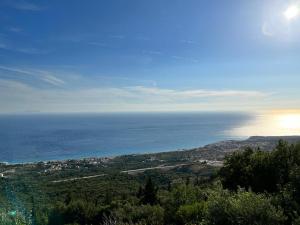 a view of the ocean from the top of a hill at Filoxenia Residence in Palasë
