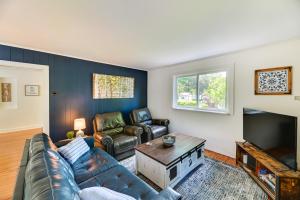 a living room with a couch and a tv at Pet-Friendly Upstate NY Home Less Than 1 Mi to Cayuga Lake in Aurora