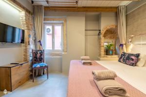 TV a/nebo společenská místnost v ubytování Casa Amando Eco Boutique House