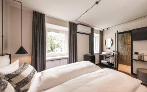 Posteľ alebo postele v izbe v ubytovaní Hotel Löwenhof