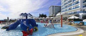 a water slide in a pool at a resort at Azura Deluxe Resort & Spa - Ultra All Inclusive in Avsallar