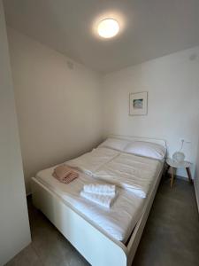 a small bedroom with a bed in a room at Luni in Zadar