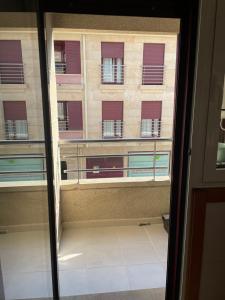 a view of a building from a window at Apartamento N&S Carolinas in Vilagarcia de Arousa