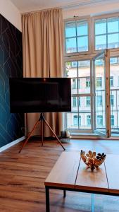 TV a/nebo společenská místnost v ubytování Premium Loft im Szeneviertel, WLAN, Smart TV, Parklplatz