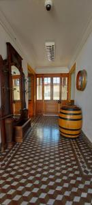 a room with a large barrel in the middle of a room at Hotel Chagual in La Serena