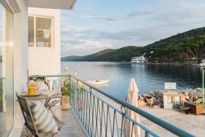 a balcony with a view of a body of water at Propela apartments in Božava